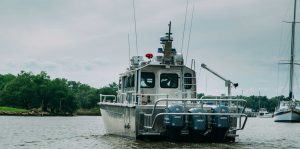Silver Ships Endeavor Series fire boat from the back with outboards