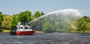 Silver Ships Islip fire boat spraying on water