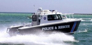 Silver Ships law enforcement police and rescue boat on ocean