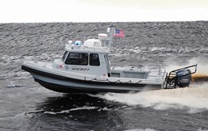 Silver Ships law enforcement boat going fast on the water