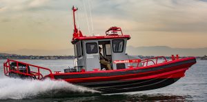 Red and gray Tow Boat U.S. Ambar boat