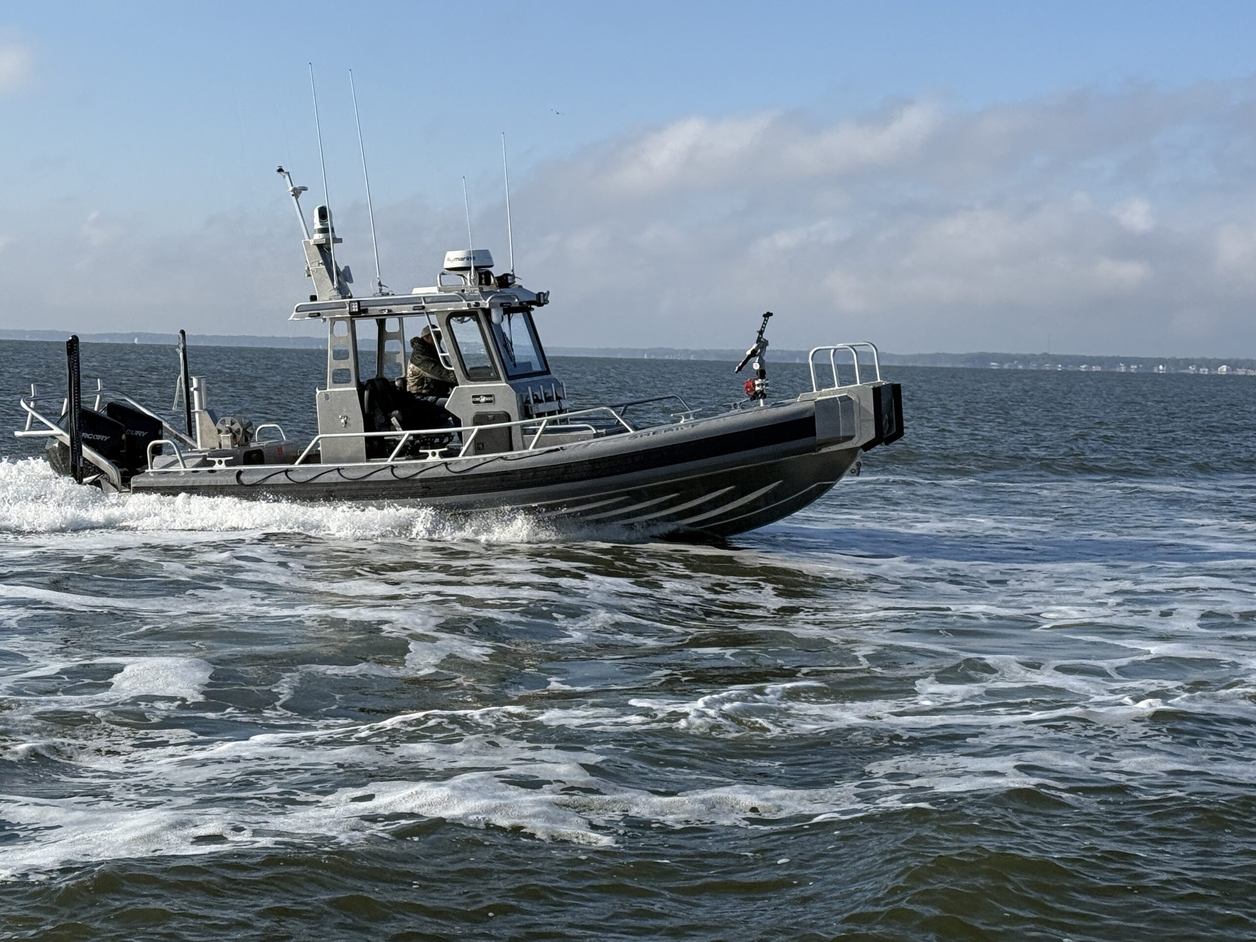 AM700 law enforcement aluminum workboat sailing on the water