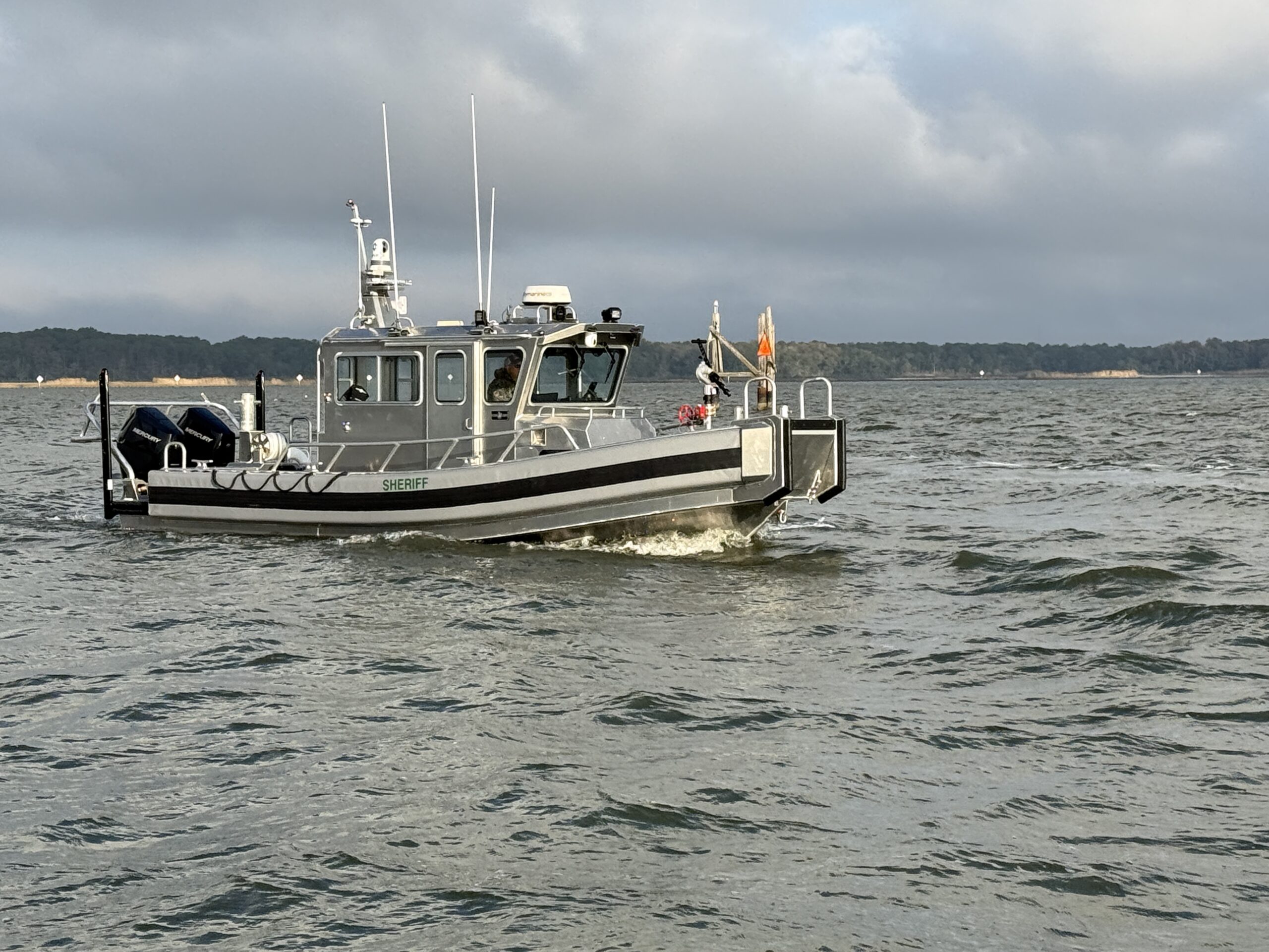 AM950 law enforcement aluminum workboat sailing on the water