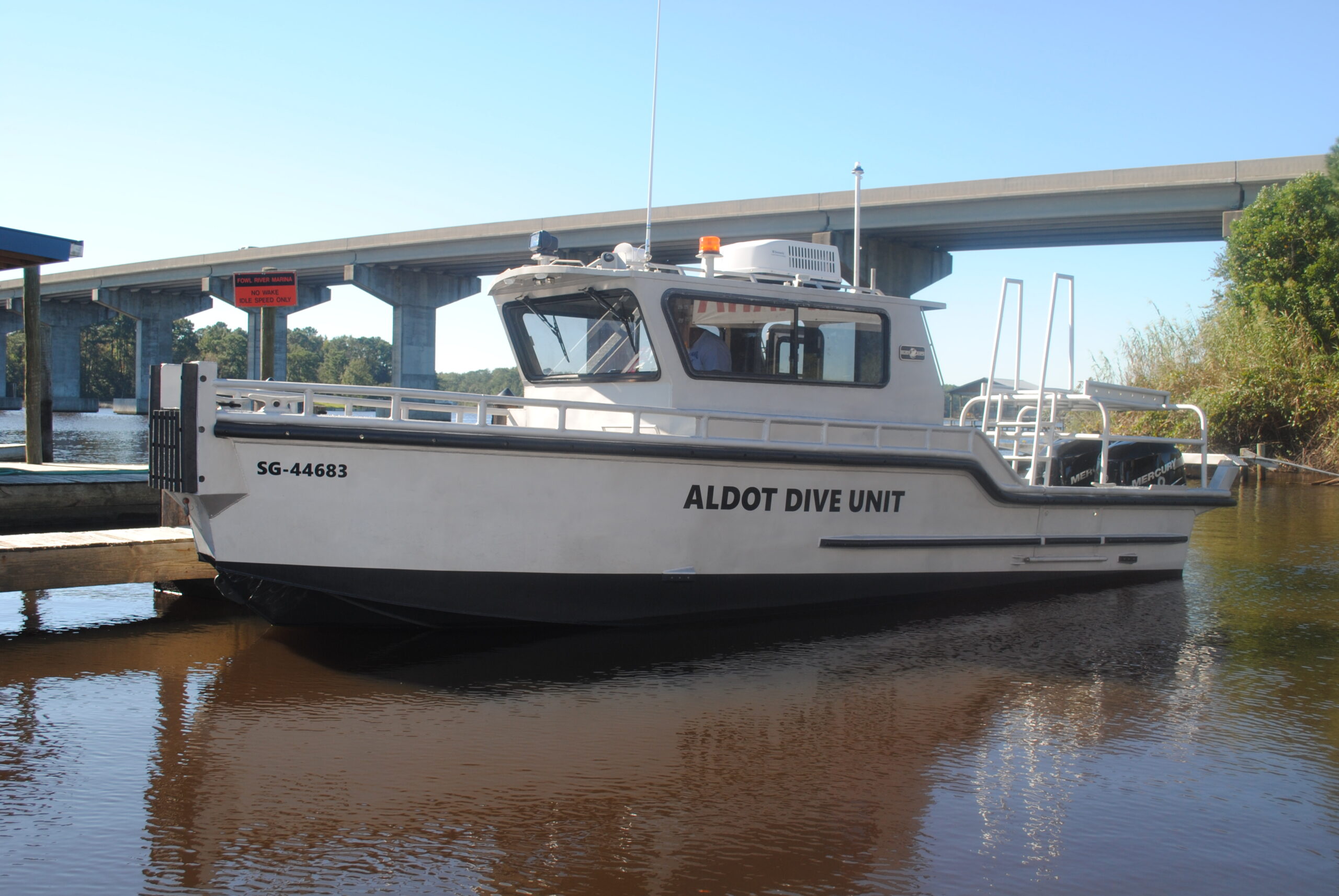 Aluminum workboat in the water after restoration