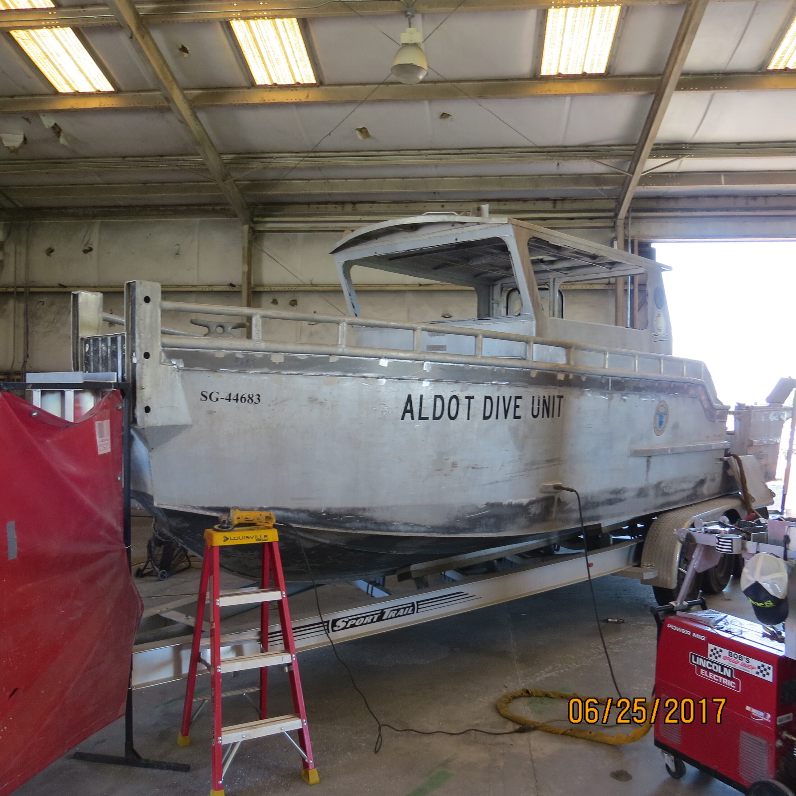 Aluminum ship in shop before restoration