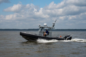 Aluminum workboat sailing through water
