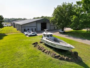 Silver Ships aluminum workboat outside of shop
